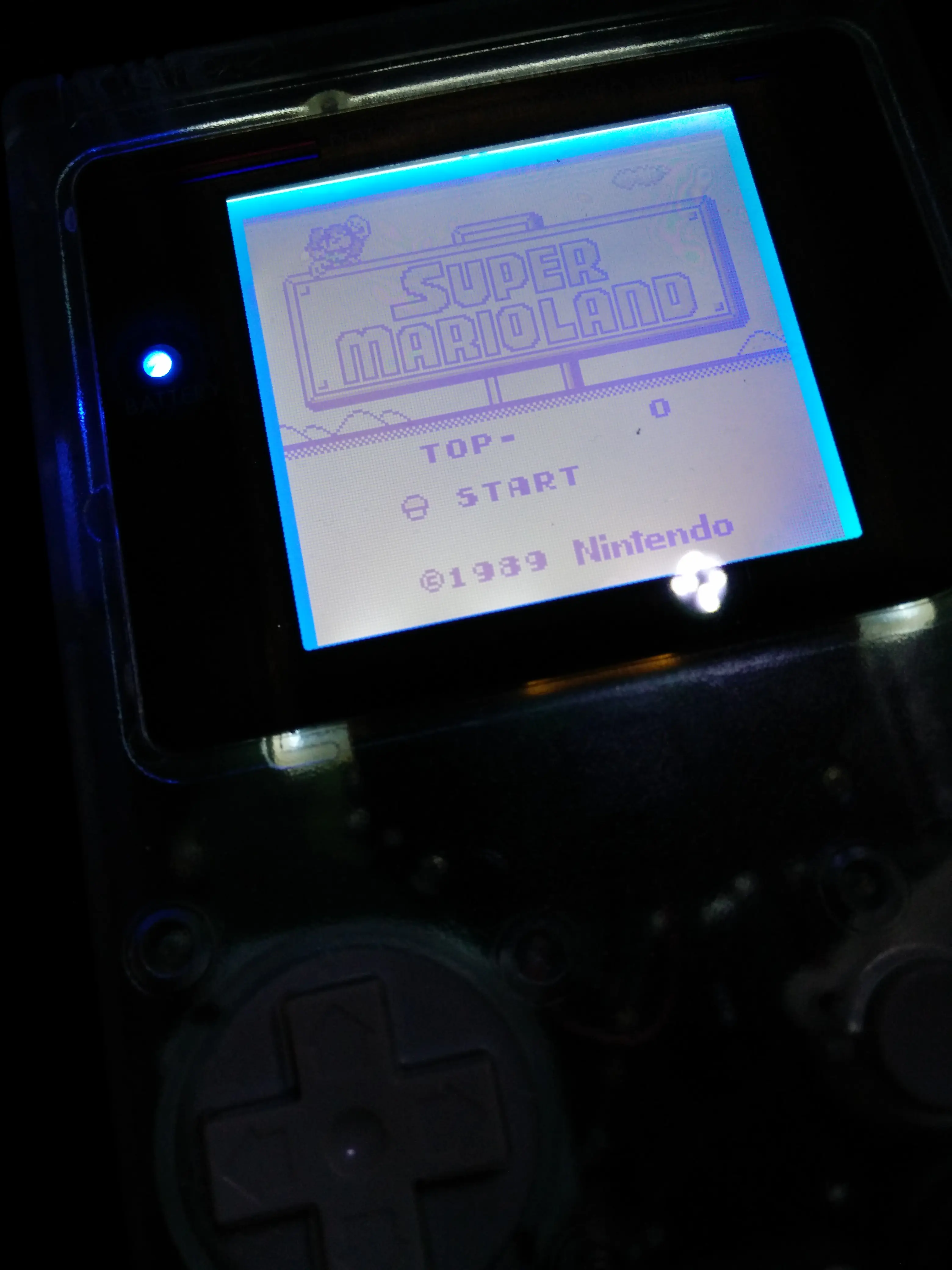 Gameboy DMG-01 Backlight Mod with Bivert Chip showing Super Mario Land title screen